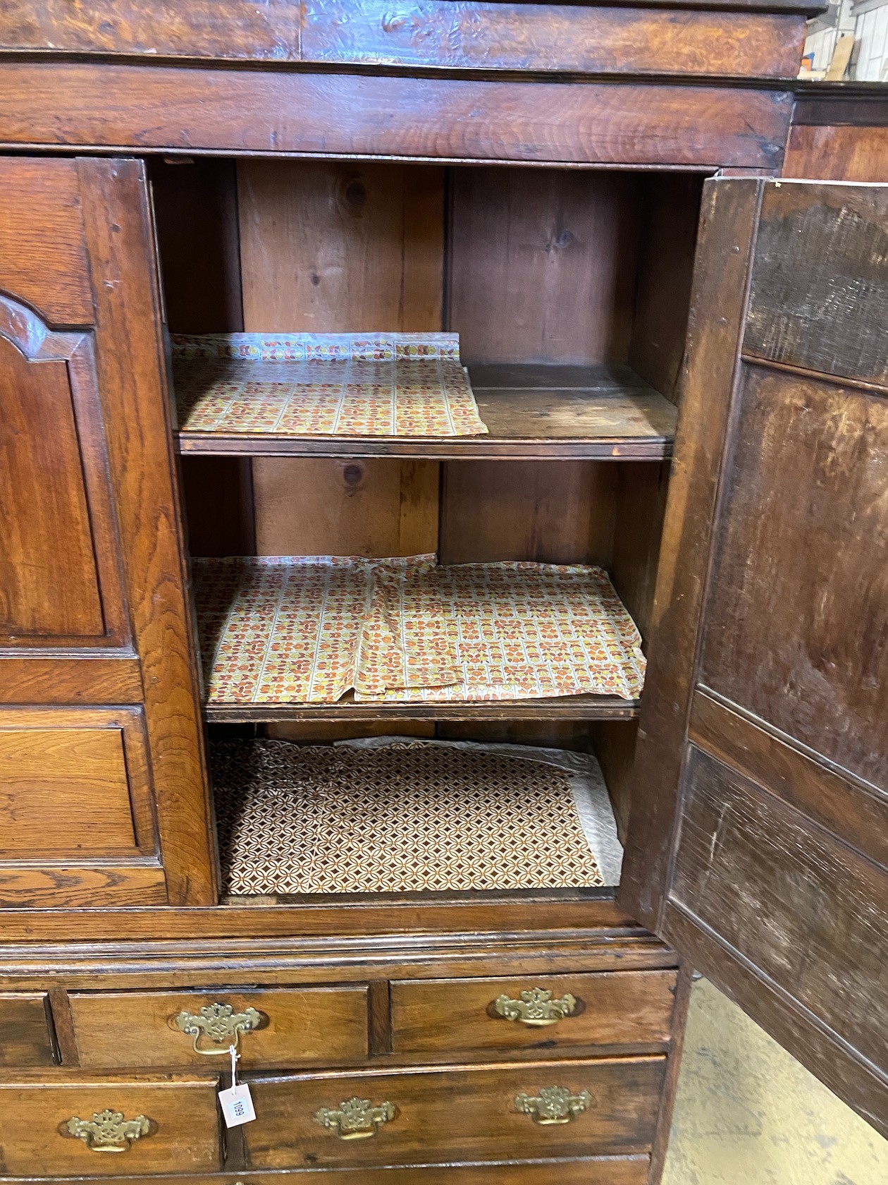 A small 18th century oak press cupboard, width 121cm, depth 51cm, height 182cm